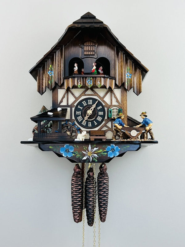 12" One Day Musical Cuckoo Clock with Men Sawing Wood, Waterwheel, and Dancers