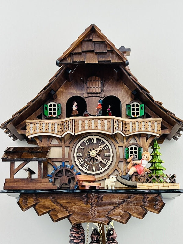 13" One Day Musical Black Forest Cuckoo Clock with Dancers, Waterwheel, and Girl on Rocking Horse