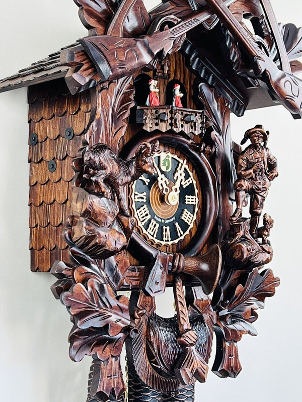 Eight Day Musical Cuckoo Clock Hunter's Style with Carved Woodsman and Stag