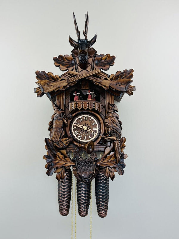 Eight Day Musical Hunter's Cuckoo Clock with Dancers - Hand-carved Live Animals, Leaves, and Buck