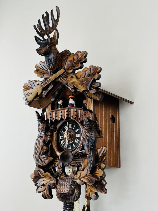 17" One Day Musical Hunter's Cuckoo Clock with Dancers, Hand-carved Animals, and Buck